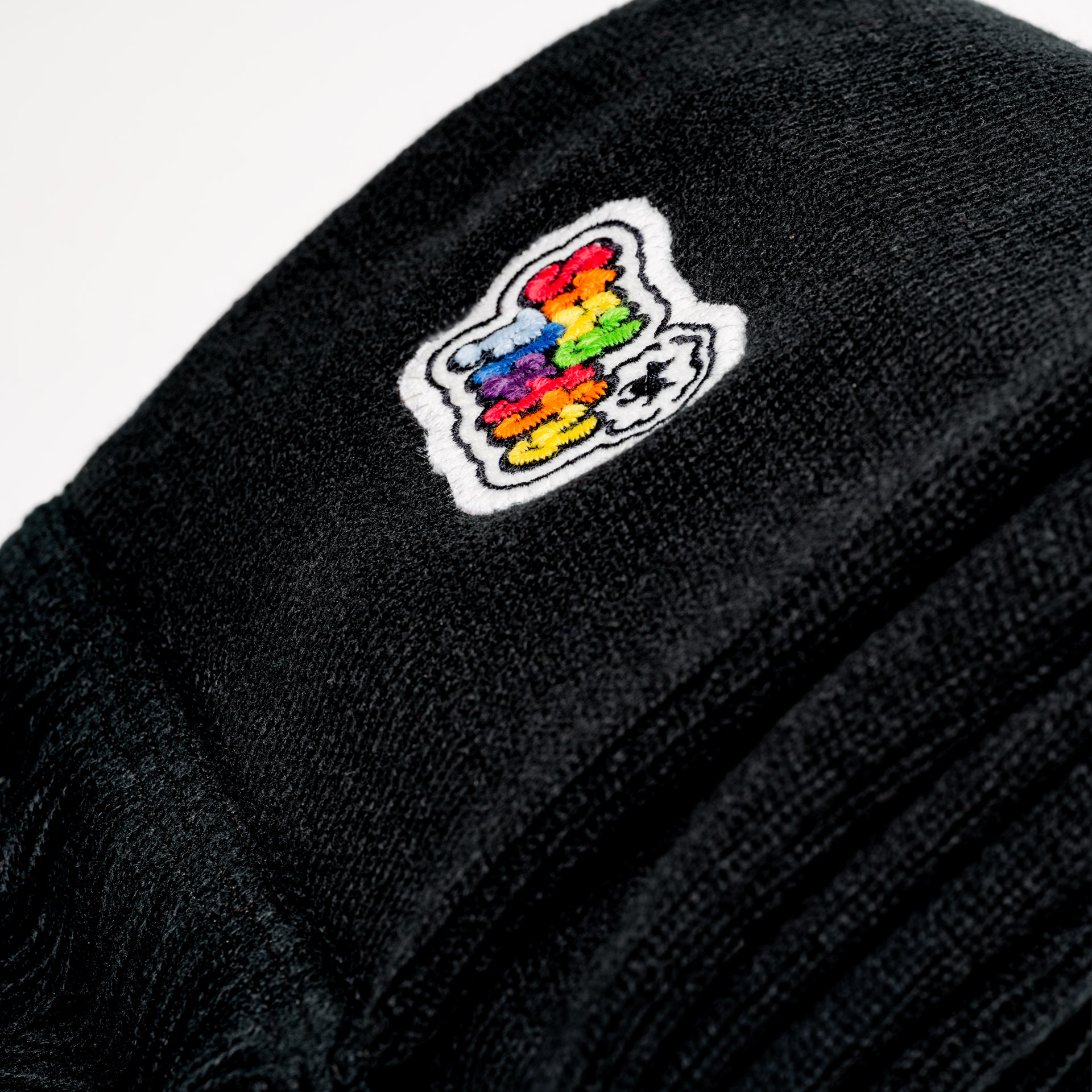 Close up of the limited edition scarf "stay fluffy" on a white background