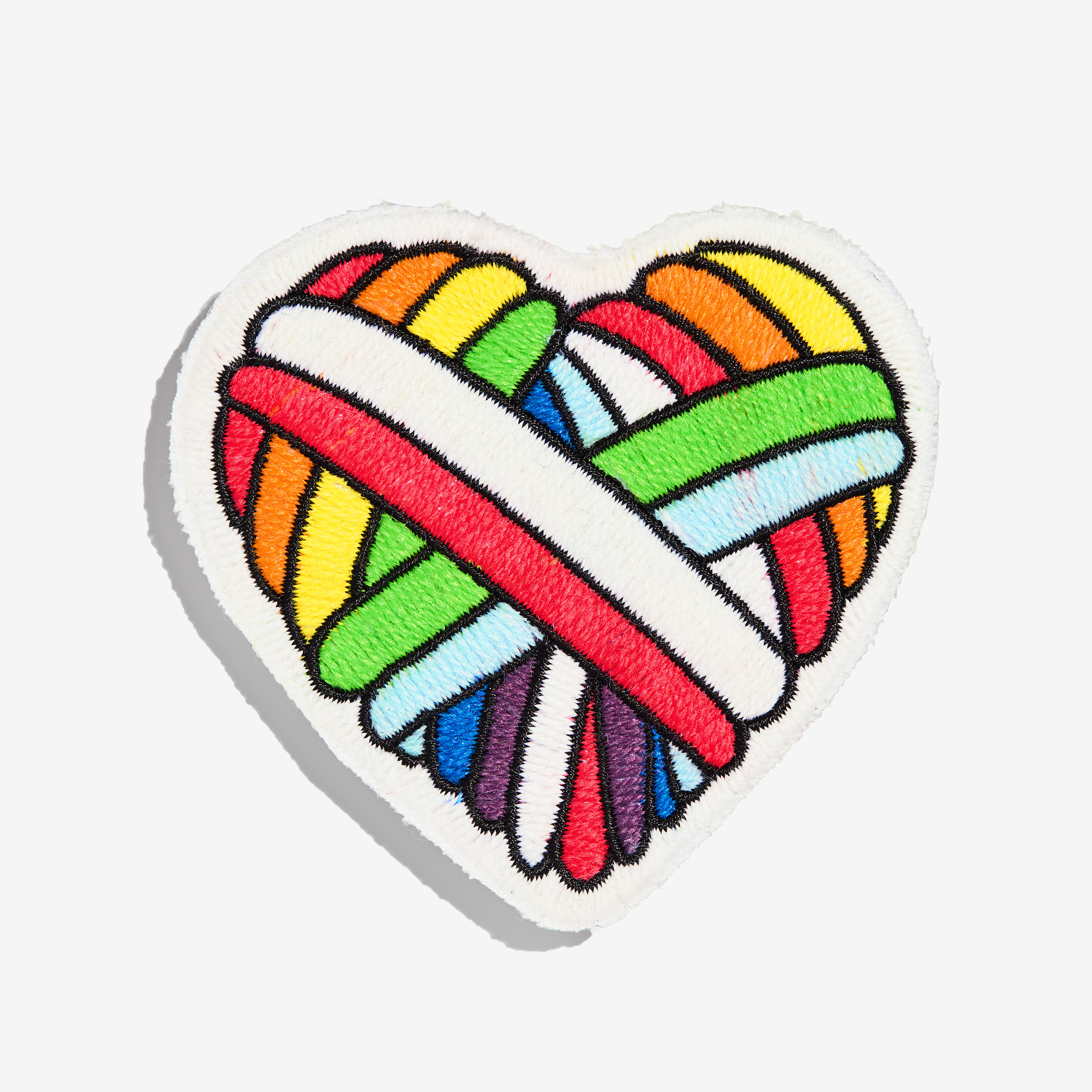 Patch "woolen heart" made of gay sheep wool on a white background.