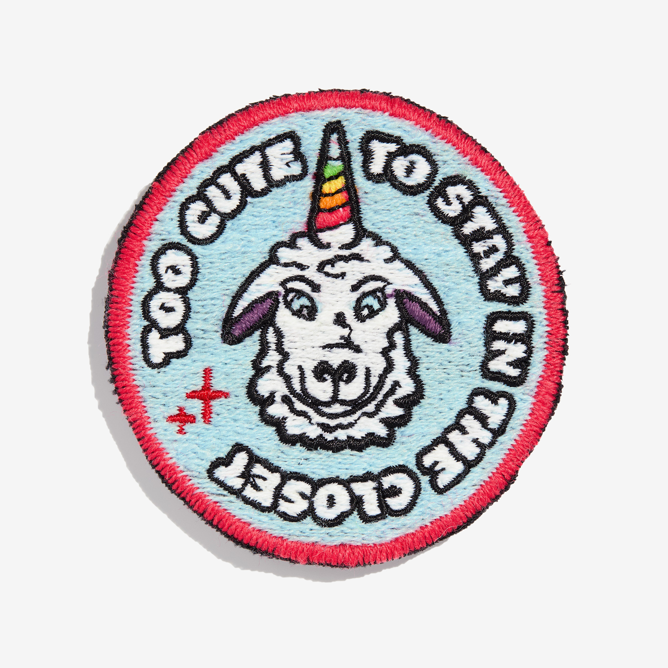 Patch "too cute to stay in the closet" made of gay sheep wool on a white background.