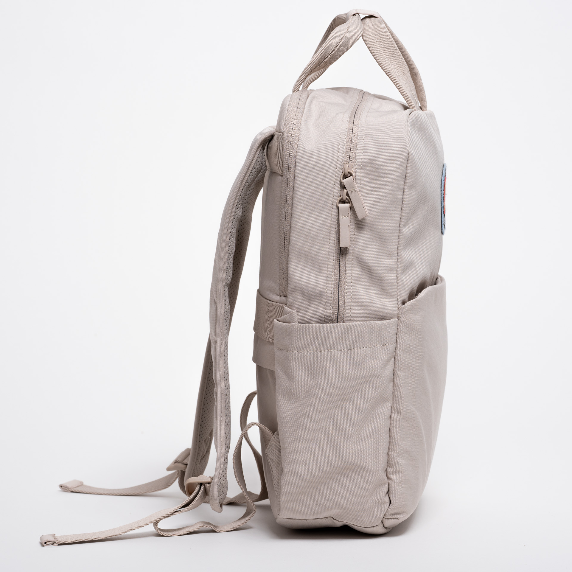 Side view of the limited edition backpack "It's cool to be schwool" on a white background 