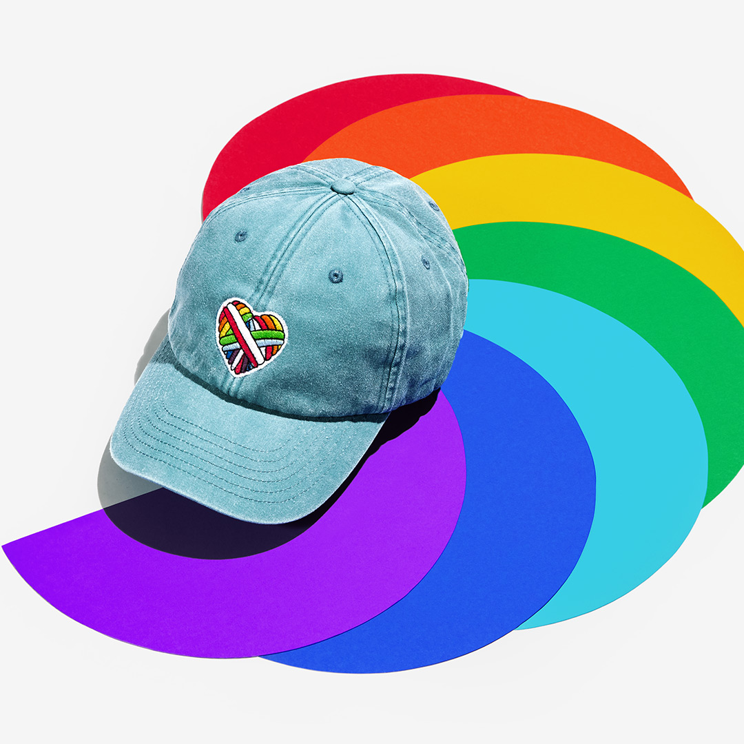 "Woolen Heart" Vintage Cap with a heart motif made of gay sheep wool on a colorful background.